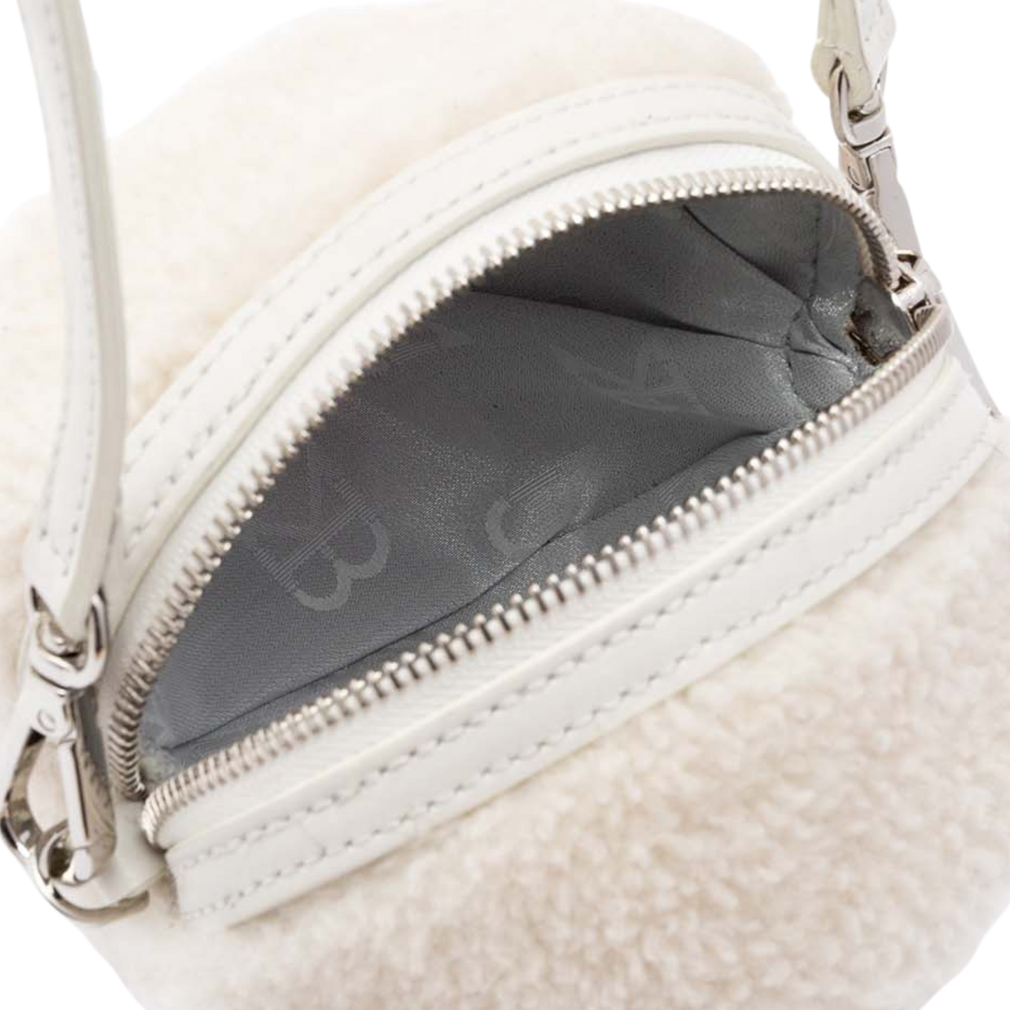 small rounded pochette in lamb fur with leather handle